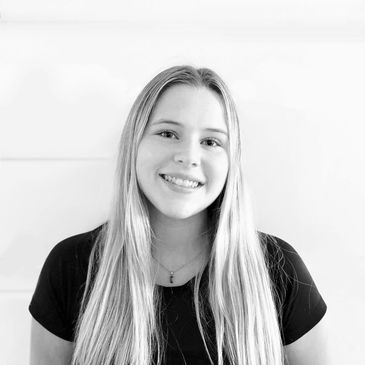 Young woman smiling at the camera.