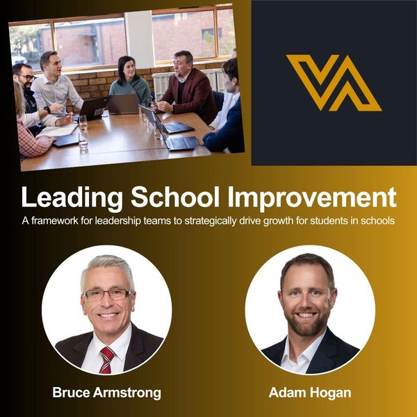 Educational leaders Bruce Armstrong and Adam Hogan collaborate on school improvement strategies.
