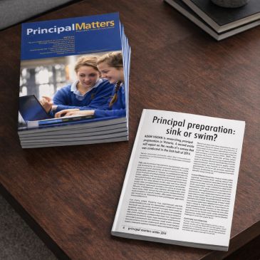 Stack of educational magazines titled Principal Matters on a wooden table.