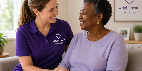A caregiver from Wright Heart Home Care smiling with an elderly woman.