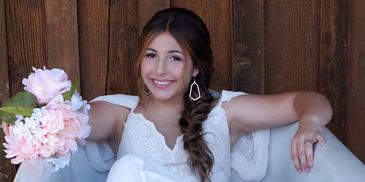 Happy bride in a bathtub posing for pictures