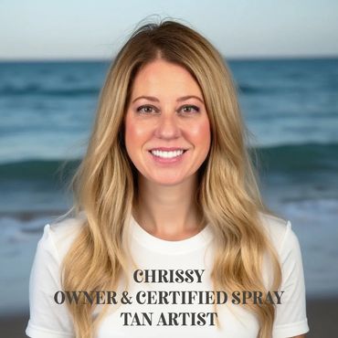 Smiling woman with long blonde hair at the beach, identified as Chrissy, a certified spray tan artist.