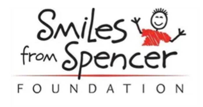 Logo of Smiles from Spencer Foundation with a stick figure in red.