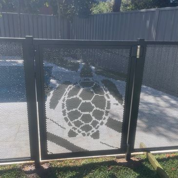 Customer picture of a turtle on a gate 