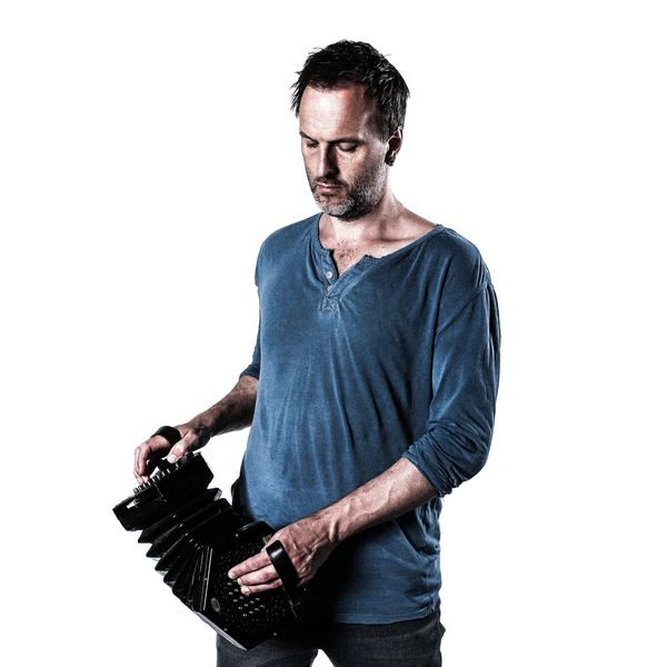 Picture of Jon Boden playing concertina by Andy Muscroft