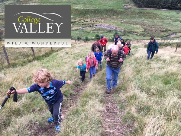Picture of families climbing a hill with College Valley logo