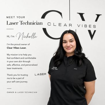 Laser technician Nicholle stands confidently in front of Clear Vibes Laser branding.