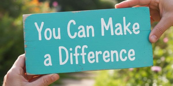 A teal sign held by two hands reads, "You Can Make a Difference."
