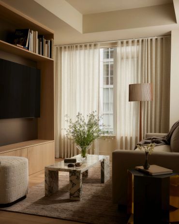 Cozy living room with neutral tones and natural light.