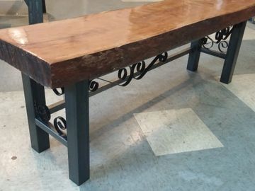 Cherry slab bench with steel legs and reclaimed fence accents