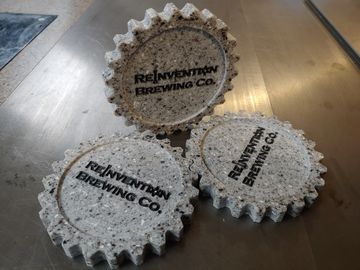 CNC carved reclaimed corian coasters for Reinvention brewing