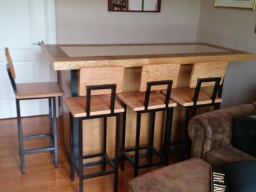 Industrial serving bar using steel and reclaimed cabinetry, 4 matching bar stools