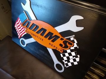 Custom cut, painted and carved sign for local auto tech