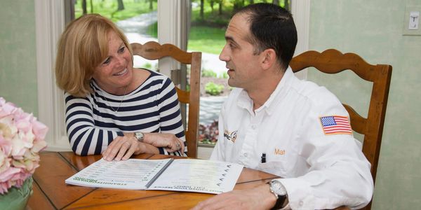 Doctor Electric owner Matt Coccia discussing options with a homeowner