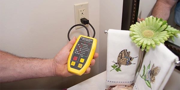 Doctor Electric team member conducting indoor electrical inspection