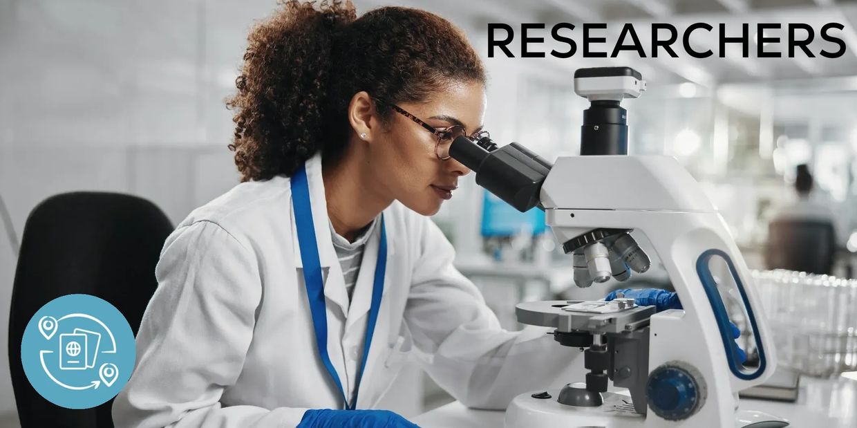Female scientist examining samples through a microscope in a lab with the word 'RESEARCHERS'