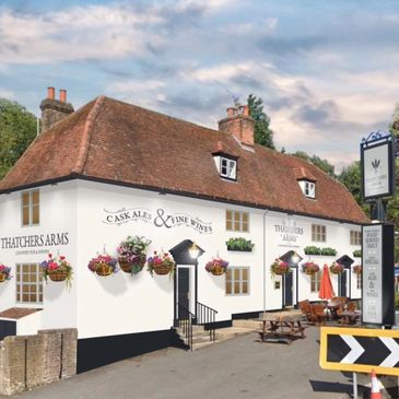 Historic Thatchers Arms pub with hanging flower baskets.