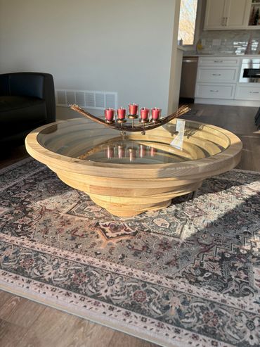 Wooden table with red candle holder in living room.