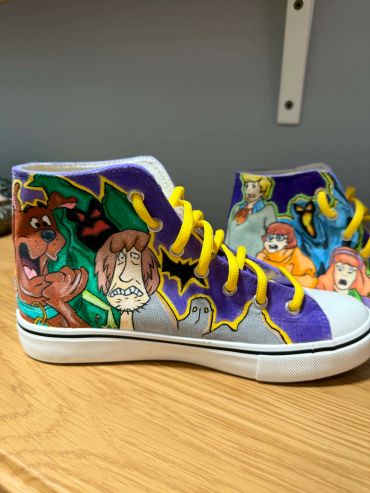 Custom Scooby-Doo themed sneakers with yellow laces.