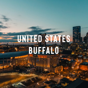 Night skyline of Buffalo, United States, with illuminated buildings and streets.