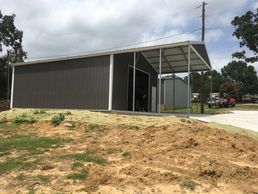 30x50x12 Texwin combo garage and carport with 10x10 roll up door.