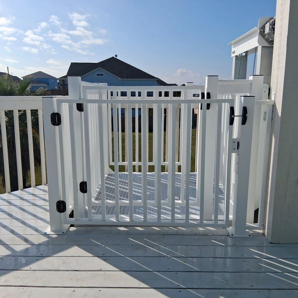 Powder coated cargo lift and matching deck gate with with safety interlock and post mount.
