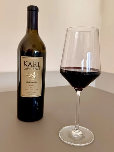 Bottle of Karl Lawrence red wine and a glass poured.