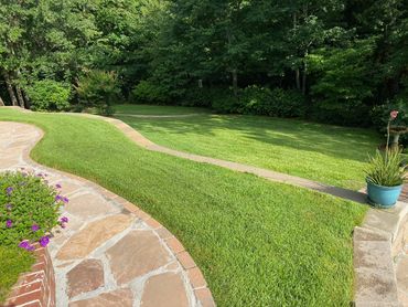 Installation of flagstone walkways and retaining wall construction in Tyler Texas