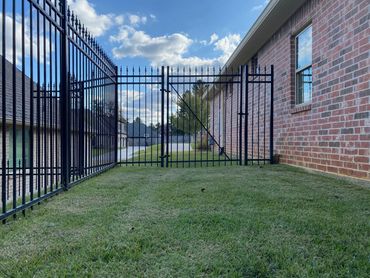 Installation of wrought iron privacy fencing at in Tyler Texas