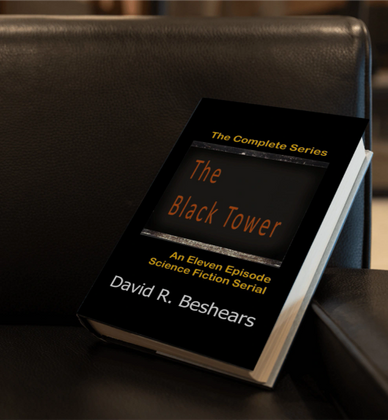Book titled 'The Black Tower' by David R. Beshears resting on a black leather chair.