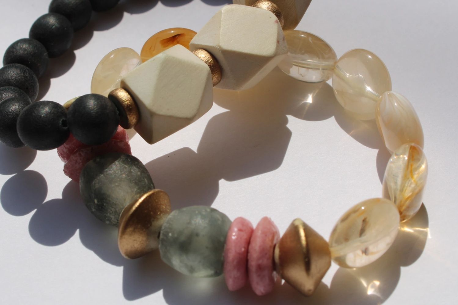 Wooden and glass bead bracelets.