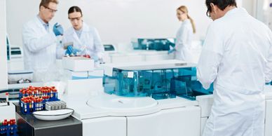 Lab techs and MLS using chemistry analyzer for cholesterol, glucose, and cardiac testing