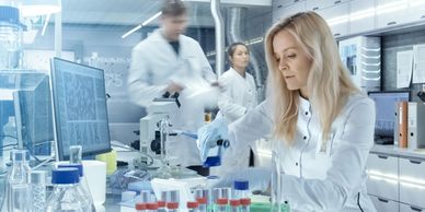 Lab technicians in a core lab preparing reagents to use in testing