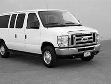 A white van parked in the parking lot.