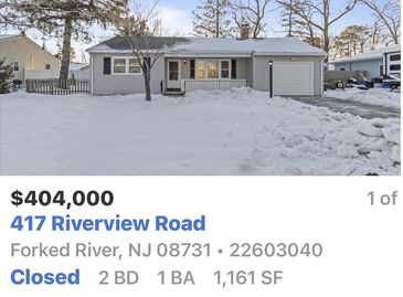 Single-story home in snow with one-car garage.