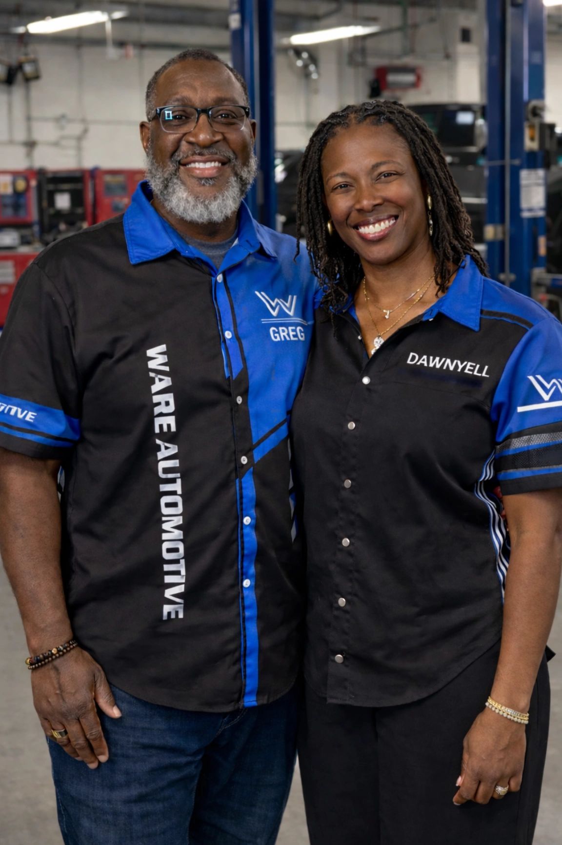 Owners Greg and Dawnyell Ware standing in the auto repair shop. 