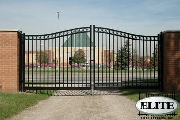 Black aluminum sliding gate installed at a modern residential home.