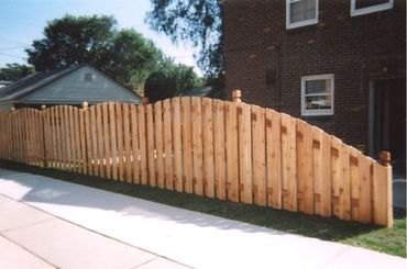 Wooden gate nestled in a residential neighborhood setting