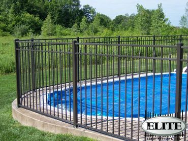 A Black Color Fence By A Pool