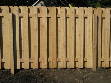 Classic wooden gate entrance to a residential yard