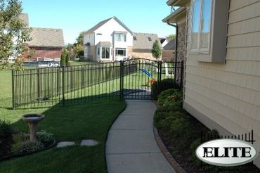 A Metallic Fence With Black Color Paint