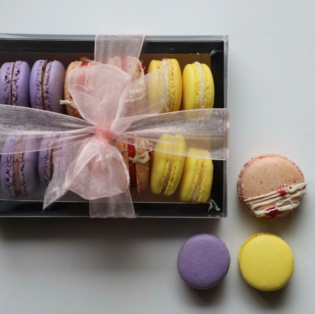 A beautiful gift set with vibrant colors. Here are black current, lemon, and raspberry macarons.