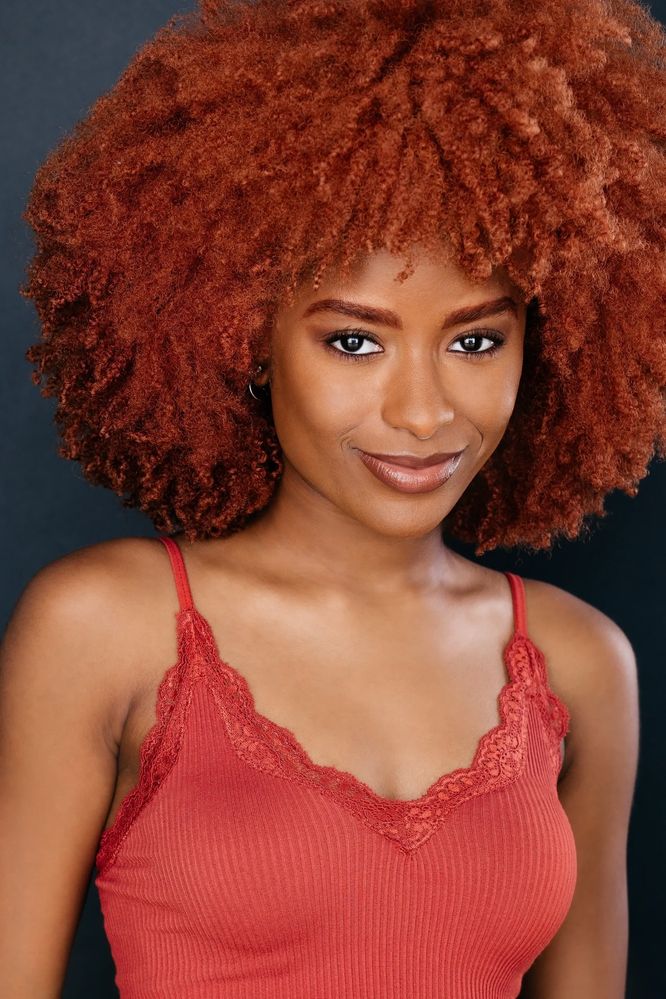 brown skin actress with ginger curly afro wearing red tank top - actor headshot - Los Angeles 
