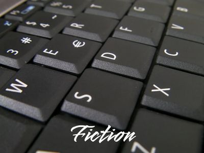 Close-up of a black computer keyboard with 'Fiction' text overlay.