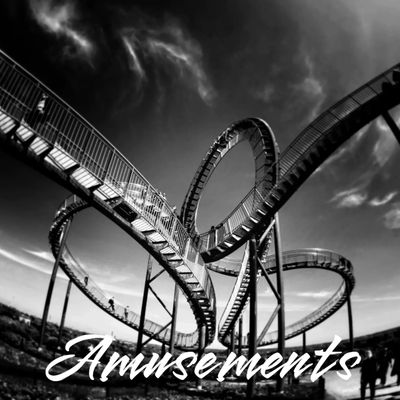 Black and white image of a roller coaster with the word 'Amusements'.