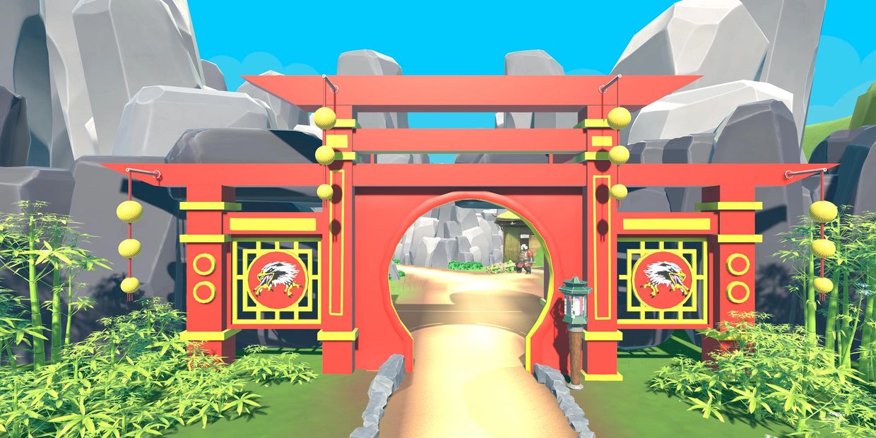 A vibrant red and yellow Asian-style gate with eagle emblems and surrounding bamboo.