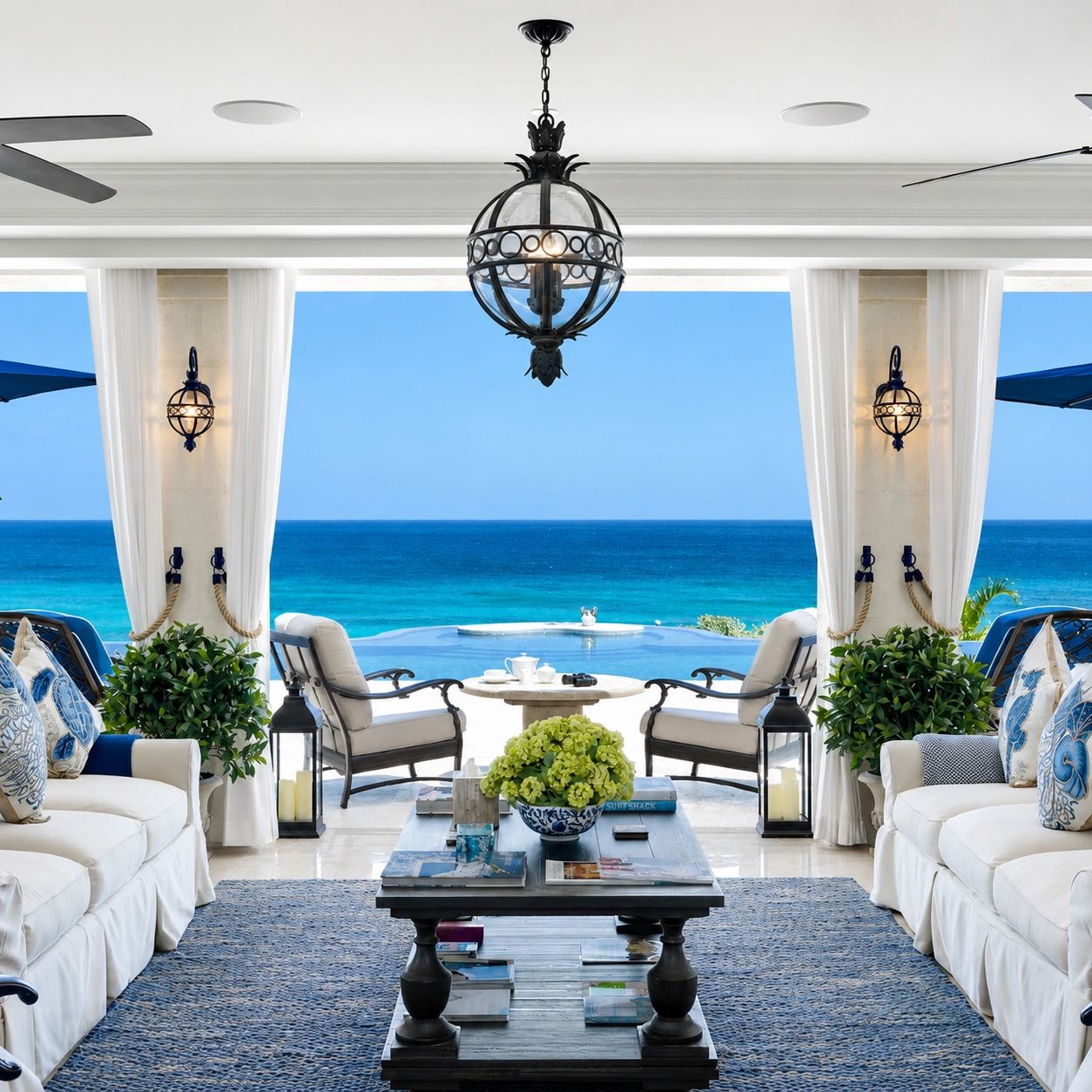 Elegant living room with ocean view and cozy seating.