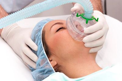 Doctor performing general anesthesia in an office or hospital
