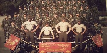 Veteran Cowboy Billy on the left holding the flag