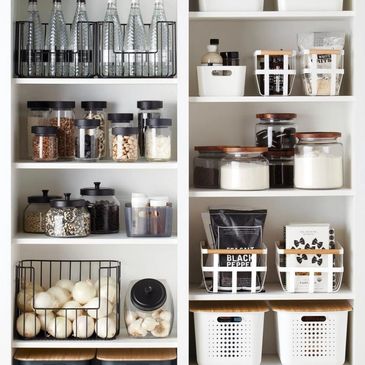 Organized pantry shelves with jars, bottles, and containers.